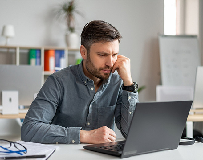 Man starting at his laptop